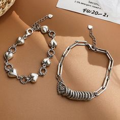 Add a touch of class and sophistication to your look with these beautiful, silver bracelets. Comes in a set of two.Material: Sterling Silver. Retro Bracelet, Silver Heart Bracelet, Silver Bracelets For Women, Circle Bracelet, Titanium Bracelet, Hand Accessories, Love Bracelet, Dainty Bracelets, Bracelet Clasps