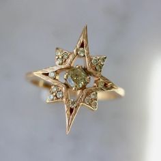 Why I Love It: A unique and symbolic eight-pointed diamond star ring. This eight-pointed starburst is associated with the symbol of Venus and as a wellspring for leading a rich and abundant life. Adorned with luscious natural yellow diamonds, and hand textured engraving make this piece next level and one you will never want to take off. Sits low profile and flush to the finger. The Details: Main Stone: Natural Yellow Diamond Shape: Cushion Size: 3.8 x 3.5mm Weight: 0.30cts Cut: Cushion Modified Gem Breakfast, Handmade Gold Ring, Handbags Vintage, Cute Engagement Rings, Rose Gold White, Dope Jewelry, Dream Engagement, White Gold Wedding Rings, Vintage Things