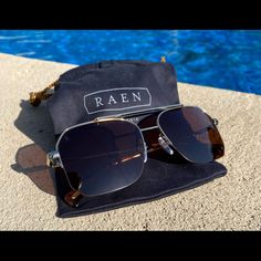 Raen Optics Munroe 55 S200 Gold Jaguar Sunglasses. * Lightweight Gold Metal Frameless * Jaguar Tortoise Acetate Temple Tips * Monoblock Hinges * Plum Amber Brown Lenses * 100% Uva/Uvb Protection, These Are Not Polarized. * Size: 55 17 140 * Brand New With Cleaning Pouch. Retail $160.00. Elegant Aviator Sunglasses With Uv Protection For Outdoor, Designer Sunglasses With Tinted Lenses For Everyday, Luxury Gradient Lenses Sunglasses For Vacation, Luxury Aviator Sunglasses With Gradient Lenses For Outdoor, Designer Anti-reflective Sunglasses For Summer, Luxury Sunglasses With Gradient Lenses For Everyday, Luxury Polarized Sunglasses For Travel, Luxury Sunglasses With Gradient Lenses, Luxury Polarized Travel Sunglasses