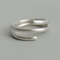 Sterling Silver Coil Ring Simple Band Wrap Ring Minimalist Jewelry Minimalist Spiral Rings For Everyday, Minimalist Spiral Stackable Rings, Minimalist Everyday Spiral Rings, Minimalist Double Band Stackable Rings As Gift, Minimalist Stackable Bypass Ring With Open Band, Minimalist Spiral Wedding Rings, Adjustable Spiral Midi Rings In Minimalist Style, Simple Sterling Silver Stackable Rings With Open Band, Simple Sterling Silver Stackable Open Band Rings