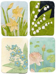 four coasters with flowers and leaves painted on them