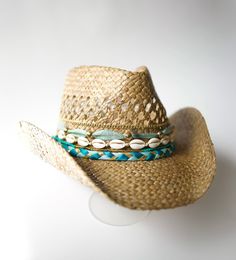 Did someone say coastal cowgirl summer??? Beach day? Country concert? Girls trip? Our handmade cowgirl hats are the PERFECT accessory for any outfit! The Kailani (or Sea & Sky) Hat is a tan straw cowgirl hat decorated with blue & gold ribbon, plain cowrie shells, & gold chain. Hawaiian Cowgirl, Cowgirl Party Outfit, Coastal Cowgirl Hat, Straw Cowgirl Hat, Cowgirl Summer, Fashion Makeover, Taylor Outfits, Bachelorette Party Beach, Straw Cowboy Hat