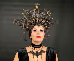 An incredibly luxurious headpiece, painstakingly crafted and hand-painted in black and gold. The crown is decorated with bats, sugar skulls, rhinestones, a chain. The headpiece fits perfectly with the costumes: Lady of Darkness, Queen of Bats, Queen of Vampires. The necklace is completely stylized as a crown and is a necklace made of velvet, metal chain and sparkling bat. The height of the composition is 7.48 inches. The size of the necklace is 11.8-13.38 inches. When placing an order, you can c Gothic Structured Crown For Festivals, Halloween Cosplay Headpiece With Structured Crown, Gold Crown Costume Hat For Halloween, Gold Fantasy Costume Hats And Headpieces For Halloween, Gold Fantasy Costume Hat For Halloween, Fantasy Gold Costume Hats And Headpieces For Halloween, Fantasy Gold Costume Hat For Halloween, Gothic Gold Costume Accessories For Festival, Fantasy Tall Crown For Halloween