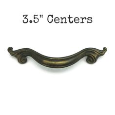 an antique brass drawer pull with the number 3 5 centers on it's side