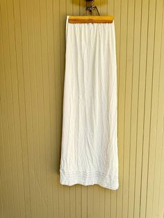 Flair Maxi Half Slip Skirt Vintage Off White Underskirt with mesh Lace Trim around the bottom. Size Small. Nylon. Made in USA. ILGWU tag. Machine Washable. Creamy off white color. Excellent condition. Elastic waist. Measures: up to 28" waist and 40" long. No side slits. See pictures for more details. Stretch Lined Maxi Skirt For Daywear, Summer Maxi Skirt With Lace Trim, Relaxed Fit, Beach Stretch Maxi Skirt With Lining, Summer Beach Maxi Skirt With Lace Trim, Half Slip, Slip Skirt, Off White Color, Vintage Skirt, Lace Trim