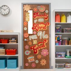 there is a door decorated with flowers and words on the front, along with other toys