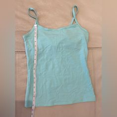 Nwot Aqua Blue (Similar To Tiffany Blue) Spaghetti Strap Tank With Bra-Shelf Inside. Size Small. See Photos For Measurements. Casual Light Blue Spaghetti Strap Tank Top, Fitted Light Blue Camisole Tank Top, Casual Light Blue Tank Top With Spaghetti Straps, Blue Stretch Camisole With Built-in Bra, Spring Blue Camisole With Built-in Bra, Blue Cotton Tank Top With Straps, Blue Cotton Top With Tank Straps, Light Blue Fitted Camisole For Summer, Fitted Light Blue Summer Camisole