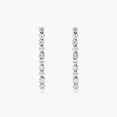 14K White Gold Aura Lab-Created Diamond Drop Earrings. Curate your collection of classic accessories with these eye-catching drop earrings. Fashioned in 14K white gold,each drop features an elongated bar lined with lab-created diamonds, these earrings secure with push backs. White Brilliant Cut Drop Earrings, Fine Jewelry Linear Earrings With Prong Setting In White, White Prong Setting Linear Earrings Fine Jewelry, White Linear Earrings With Prong Setting, Brilliant Cut White Gold Linear Earrings, Timeless White Drop Earrings, Timeless White Linear Drop Earrings, Gold Aura, Classic Accessories