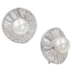 Vintage Harry Winston Pearl and Diamond Clip-On Earrings In Platinum. Circa 1960's. The earrings feature circular design, set in the center with total of two 12mm white cultured pearls. Surrounded by 56 tapered baguettes with total weight of approximately 15.00 carats Stamped: Jacques Timey makers Mark, PT950, Winston, OR. Diameter: 26mm. Signed HW Luxury Classic Diamond Clip-on Earrings, Harry Winston Emerald Earrings, Harry Winston Diamond Earrings, Harry Winston Gold Earrings, Vintage Harry Winston, Harry Winston, Pearl Diamond, Cultured Pearls, Makers Mark