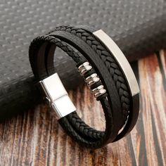 Material: Alloy Style: Original Design Black Leather Strap Wristband As Gift, Modern Black Leather Strap Wristband, Leather Bracelet With Black Band, Leather Bracelet With Black Band As Fashion Accessory, Black Band Leather Bracelet, Trendy Black Leather Strap Bracelet, Trendy Black Leather Bracelet, Modern Leather Bracelet With Black Band, Trendy Black Bracelet Jewelry