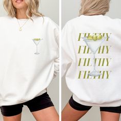 Introducing our Extra Dirty Martini Sweatshirt, the ultimate fashion statement for martini enthusiasts and the perfect gift for brides-to-be who appreciate signature drinks! Dive into the world of tantalizing martini cocktails with this extra olive-filled design. 🍸 Extra Olive Bliss: If you can't resist an extra dirty martini with loads of olives, this sweatshirt is a tribute to your unique taste. 👰 Perfect Bride Gift: Searching for a thoughtful gift for a bride who loves signature cocktails? Martini Bachelorette Party, Martini Bachelorette, Lounge Fashion, Signature Cocktails, Single Shirt, Perfect Bride, Dirty Martini, Bachelorette Shirts