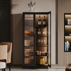 a cabinet with wine glasses and bottles in it next to a dining room set up