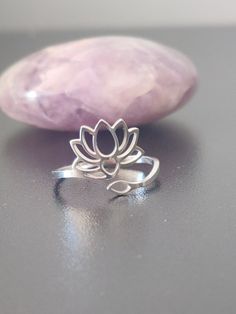 Minimalist Lotus flower women's ring, Zen meditation symbol ring, Buddhist ring in stainless silver. The lotus flower is a beautiful symbol of purity and rebirth. Emerging from muddy waters to blossom into a vibrant flower, it embodies the ability to overcome obstacles and achieve a state of beauty and serenity. In many cultures, it represents spiritual enlightenment, personal growth and inner strength. Wearing jewelry adorned with a lotus flower brings a spiritual touch to your daily life. Mate Meditation Symbols, Lotus Flower Jewelry, Lotus Necklace, Wearing Jewelry, Beautiful Symbols, Zen Meditation, Muddy Waters, Spiritual Enlightenment, Night Market