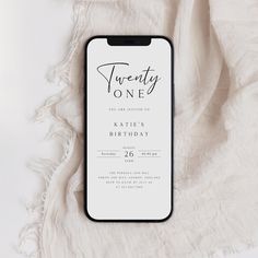 a white and black birthday card with the words twenty one on it next to a blanket