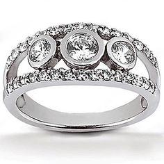 a white gold ring with three diamonds on it