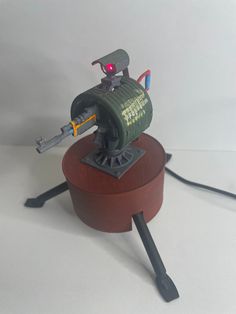 3d printed auto turret based off the in game turret from 'Rust' This turret is fully operational and moves 90 degrees, with a working laser mounted on top - just like the in-game turret. There is a cheaper, non motorised alternative that does not include these features. This turret is 3d printed with eco friendly filament and measures roughly 11.5cm (W) by 11.5cm (H). All turrets are made to order and can include either an AK or Bolt rifle. Every item we sell is hand filed, primed, painted and a Rust Game, 90 Degrees, 3d Printed, Video Games, Rust, Eco Friendly, Electronic Accessories, Electronics, Fan Art