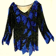 Vintage Nwot. You Will Feel So Elegant The Moment You Slip Into This Sweelo 100% Silk Hand Beaded Blouse. Black Sequined Background With Cobalt Blue Sequined Details. The Front Bodice Is Sheer Black With Rhinestones. The Back Is A Flattering V-Neck. Comes With Shoulder Pads That Are Easily Removable. Comes With Replacement Rhinestones Should They Be Needed. Please See The Fun Details On Sleeve And Hem To Accent The Blue Leaf Design. From A Smoke Free Home. Seller Reference Only: B16 Beaded Tops For Night Out In Fall, Beaded Tops For Fall Night Out, Long Sleeve Beaded Party Tops, Beaded Fitted Tops For Winter, Beaded Long Sleeve Tops For Night Out, Fitted Beaded Tops For Winter, Elegant Beaded Long Sleeve Tops, Elegant Long Sleeve Beaded Tops, Fall Party Beaded Tops