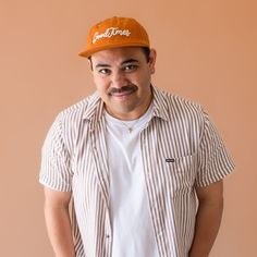 Get ready to let the good times roll with our Good Times Flat Brim Hat. This cool hat features a flat brim and a unique burnt orange shade, with ivory embroidered text for a pop of contrasting color. Perfect for beach days or adding some good vibes to your everyday outfits. Casual 5-panel Snapback Hat For Vacation, Casual Brown Flat Cap Trucker Hat, Casual Flat Bill Dad Hat For Beach, Casual 5-panel Dad Hat For Beach, Casual Orange Sun Hat, Brown Snapback Hat With Flat Bill For Summer, Brown Flat Bill Snapback Hat For Summer, Orange Baseball Cap With Curved Brim For Beach, Orange Curved Brim Baseball Cap For Beach