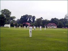 Englefield Green - a cricket match in full swing on the Green. Englefield Green is the home of Pairfum. Cricket Match