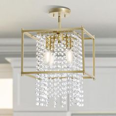 a chandelier hanging from the ceiling in a room