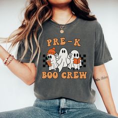 You will love this Halloween pre-k boo crew shirt! This is the perfect trendy tee for pre-k teachers and  pre-k teacher teams to wear during the fall/Halloween season and makes a great Halloween gift for teacher teams! PRODUCTION TIME: 2-5 business days  SHIPPING TIME: 2-5 business days  PRODUCT DESCRIPTION: These ultra soft pigment dyed shirts are one of our best sellers, 100% Cotton. 100% ring spun cotton Preshrunk, soft-washed, garment-dyed fabric Set-in sleeves Double-needle stitched sleeves Trendy Fall T-shirt For School, School Crew Neck T-shirt For Fall, Crew Neck T-shirt For School In Fall, Fall School Spirit Graphic T-shirt, School Spirit Crew Neck T-shirt With Character Print, School Spirit T-shirt With Character Print, Casual Fall T-shirt For School, Trendy School T-shirt For Fall, Halloween Crew Neck Soft-washed T-shirt