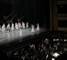 a group of people standing on top of a stage