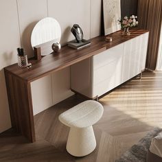 a modern console table with mirror, stool and vase