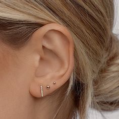 Classic & timeless, these studs are perfect for a minimal effortless look. Truly perfect in any piercing location. Our teeny tiny 2mm size is made for those 2nd, 3rd, and 4th cartilage piercings. Safe for sensitive skin, our pieces are hand crafted and made to wear 24/7. Available in 2 ball sizes, 2mm (super tiny) and 3mm (small) 3mm available in gold filled or 14k solid gold, 2mm available only in solid 14k gold. Available as a single stud or in a pair. These earrings come with our signature mini push-on butterfly backings for the most hygienic and comfortable fit. Less metal behind your ears means less build-up and more room for multiple piercings close together. Tiny Earrings Studs, 2nd Ear Piercing, Cartilage Piercings, Hair Cuffs, Baby Ball, Multiple Piercings, Lobe Piercing, Tiny Earrings, Tiny Stud Earrings