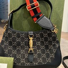 Excellent Condition-Comes With Dust Bag, Original Box, Strap And Strap Extender. Longest Length: 11” Height 7.5” Width 1.5” Drop 7.5” Drop 23”. Authentic Gucci Jacquard Denim Gg Monogrammed Small Jackie 1961 Hobo In Black And Ivory. Stored In Box, Smoke Free Home. Would Be Open To Trading For Goyard Tote Bag- Gucci Jackie 1961, Goyard Tote Bag, Goyard Tote, Bags Gucci, Gucci Bags, Black Cream, Long Length, Original Box, Crossbody Bag