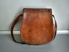 Vintage genuine leather bag - Retro leather bag - Old leather bag from 70' - brown leather bag - Old Genuine Leather Bag - Shoulder bag Beautiful shoulder bag made of genuine leather . For people who love items with history . Dimensions : Height without the handle - 23.5 cm 24 cm x 23.5 cm x 7 cm For other GENUINE LEATHER BAG please check here : https://www.etsy.com/shop/TheVINTAGEShopBG?ref=l2-shopheader-name&section_id=22456024 All pictures are real . You buy exactly what you see in the ph Vintage Tan Crossbody Bag, Vintage Tan Satchel Shoulder Bag, Brown Saddle Satchel In Soft Leather, Brown Soft Leather Saddle Satchel, Vintage Tan Shoulder Bag For Daily Use, Vintage Tan Satchel For Daily Use, Vintage Tan Bags For Daily Use, Old Leather Bag, Leather Folder