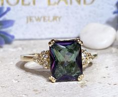 Don't miss this opportunity to own this beautiful gemstone ring crafted in 14k gold filled => Gemstone Type - Mystic Topaz, Clear Quartz => Gemstone Cut - Faceted => Gemstone Size - 8*10 mm, 2 mm => Total Number of Gemstones - 7 => Metal Type - 14k Gold Filled (Tarnish Resistant And Nickel Free) - also available in 925 sterling silver * Please contact me for pricing on a sizes larger than 11 * ~ Feel free to ask me about custom made designs. ❏ Replacements and custom orders : ✪ 92 Elegant Multi-stone Rectangular Rings, Elegant Rectangular Multi-stone Rings, Rectangular Amethyst Ring In 14k Gold, Rectangular 14k Gold Jewelry With Accent Stones, Gold Amethyst Rectangular Ring For Wedding, Gold Rectangular Amethyst Ring For Wedding, Rectangular Emerald Ring With Accent Stones Gift, Rectangular Emerald Ring With Accent Stones As A Gift, Heirloom Rings With Emerald Cut And Gemstone Accents