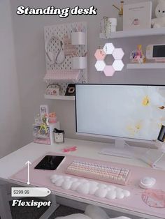 a computer desk with a keyboard, mouse and monitor on it's stand next to shelves