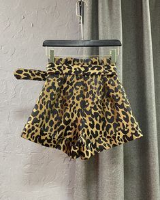 KERRY SHORTS
  High waist
 
 Belted
 Pockets
 Leopard print
 
 Matching belt
 Material - cotton, polyester
     SIZE WAIST HIPS LENGTH   XS cm 62 100 36   inches 24.4 39.4 14.2   S cm 66 104 36   inches 26 40.9 14.2   M cm 70 108 37   inches 27.6 42.5 14.6   L cm 72 112 37   inches 28.3 44.1 14.6    CARE INSTRUCTIONS: Don't Bleach, Don't dry clean, Don't iron, for better washing results use the hand wash at water temperature 30°.

THANK YOU for visiting our shop! We hope to offer you an amazing Graphic Pant, Party Dress Long Sleeve, Crop Top Sweatshirt, Corsets And Bustiers, Lounge Lingerie, Puff Sleeve Dresses, Party Dress Long, Water Temperature, Boho Maxi Dress