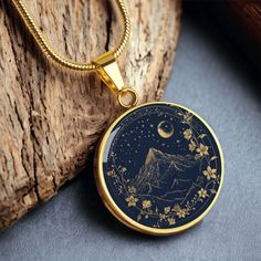 Acotar Merch,Acotar Jewelry,Acotar Wedding,Velaris Gold Star and Mountain Pendant with Engraving,Fantasy Reader Jewelry,Bookstagram Gifts  Introducing our exquisite Celestial Mountain Range Pendant with Chain--a glossy masterpiece available in gold or silver finish. This pendant features the MOH mountain range against a navy blue background, surrounded by stars and a crescent moon--a harmonious blend for both nature lovers and ACOTAR readers. Crafted with precision, this pendant captures the ess Acotar Inspired Jewelry, Acotar Jewelry, Acotar Wedding, Acotar Merch, Mountain Pendant, Crafted Bag, Bookish Merch, Celestial Wedding, Navy Blue Background