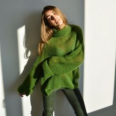 Hello, I'm the one, who won't let you down - green mohair turtleneck  sweater.I will comfort you, keep you warm and will make you smile. I'm 100% hand made and proud of that. I consist of 70% italian kid  mohair and 30% of nylon, which makes me incredibly natural. I'm quite unique as could be worn all year long.I'm in one size and one size fits all because my measurements are :❤️   Width -63 cm❤️   Lengths -65 cmIf you would like me in other size, you could request a custom order with your own p Mohair Turtleneck Sweater For Fall, Green Soft Knit Turtleneck Sweater, Fall Mohair Turtleneck Sweater, Fall Turtleneck Mohair Sweater, Oversized Green Turtleneck Sweater, Trendy Green One-size Sweater, Green Mohair Knitted Sweater, Cozy Hand Knitted Green Sweater, Cozy Hand-knitted Green Sweater