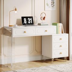 a white desk topped with a laptop computer