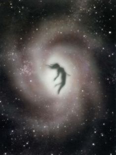 a black and white photo of a person in the center of a spiral galaxy with stars