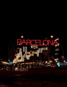 a large sign that reads barcelona lit up at night