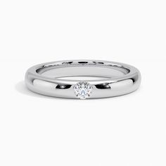 Apex Diamond Wedding Ring - Platinum. This striking band features a shimmering diamond flush-set at its center. Eye-catching and unique, this ring is sure to command attention (1/10 total carat weight). Modern Diamond Rings With Thick Band, Elegant Thick Band Diamond Promise Ring, Modern Thick Band Diamond Ring For Weddings, Wedding Ring With Single Cut Diamonds And Thick Band, Modern White Gold Wedding Ring With Thick Band, Single Diamond Anniversary Bands, Anniversary Diamond Band With Single Diamond, Anniversary Bands With Single Diamond, Formal Rings With Single Cut Diamonds And Thick Band