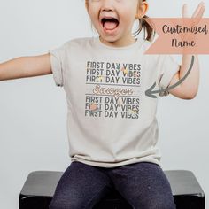 The kids will head back to school in style this Fall with this soft, lightweight tee! Customizable names and colors. We also have adult sizes available for all the teachers and school helpers out there! Link here for adult sizes https://etsy.me/45PMvZM  *PRODUCT DETAILS* *Solid colors are 100% cotton except Ash - 99% cotton and 1% polyester *Heather colors and Solid Black Blend are 52% cotton, 48% polyester *Athletic Heather and Black Heather are 90% cotton, 10% polyester *Ribbed knit makes the collar highly elastic and helps retain its shape *Twill tape covers the shoulder seams to stabilize the back of the garment and prevent stretching *SIZE & FIT* *Retail fit *Tear away label *Runs true to size *Unisex *Sizing Chart included in images *Rolled Sleeves are styled for photos *CARE INSTRUC Personalized Short Sleeve T-shirt For Back To School, Casual T-shirt With Name Print For School Events, Casual Text Print T-shirt For Daycare, Back To School Everyday Crew Neck T-shirt, Personalized T-shirt For School Events At Year End, Personalized T-shirt For End Of School Year, Crew Neck T-shirt With Name Print For Daycare, Back To School T-shirt With Name Print For Daycare, Name Print T-shirt For Daycare And Back To School