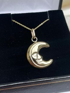 Enhance your jewelry collection with this exquisite Italian Moon necklace, crafted by Simonian® Jewelry. The yellow gold necklace is 28 inches long and features a hollow charm pendant in the shape of a moon with a content smile. The pendant is made of Solid 14K Gold and comes with a Certificate Guarantee. The necklace is perfect for anyone who loves fine jewelry and wants to add a touch of elegance to their look. The charm does not have any stones, making it a versatile piece that can be worn wi Celestial Style Necklace With Polished Finish As Gift, Gold Celestial Necklace With Polished Finish, 14k Gold Crescent Celestial Necklace, 14k Gold Celestial Moon Phase Necklace, Celestial Crescent 14k Gold Necklace, Engraved Celestial 14k Gold Necklace, Fine Jewelry Moon Phase Necklace In 14k Gold, Fine Jewelry 14k Gold Moon Phase Necklace, 14k Gold Moon Phase Necklace