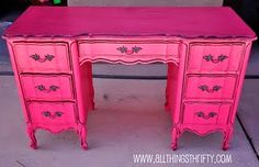 an old pink desk is painted bright pink