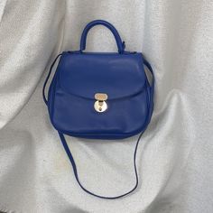 Giorgio Armani Handbag. New, Was Never Used. Still Has Some Of The Plastic On Hardware. Rich Royal Blue Color. Made In Italy. Center Clasp Closure. Top Handle And Shoulder/ Crossbody Strap. Comes With Dust Bag. Royal Blue Color, Giorgio Armani, Crossbody Strap, Soft Leather, Top Handle, Royal Blue, Dust Bag, Bag Lady, In Italy