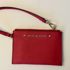 Michael Kors Karla Red Leather Small Wristlet This Essential Karla Wristlet From Michael Michael Kors Is Crafted From Leather And Flaunts Polished Gold-Tone Hardware. Brand New - No Tags Or Box. It Was A Gift. Gold-Tone Exterior Michael Kors Logo Hardware 3 Interior Credit Card Slots Leather Wristlet Strap; 6 Inch Length Top Zip Closure 5-1/2" Width X 4" Height X 1/2" Depth Leather; Lining: Polyester Red Wristlet With Removable Pouch As Gift, Red Clutch Wristlet With Zipper Closure, Red Wristlet With Zipper Closure As Gift, Red Wristlet Gift, Red Clutch Wristlet With Zipper, Red Wristlet Clutch With Removable Pouch, Red Clutch Wristlet With Removable Pouch, Red Wristlet With Zipper, Red Zipper Pouch Wristlet