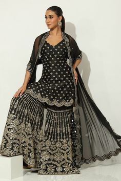 Black padded kurta featuring mirrorwork embellished floral buttis, side slits and scalloped borders. Comes with embellished gharara and scalloped border dupatta. - Aza Fashions Kurta Patterns, Scalloped Border, Dupion Silk, Set For Women, Aza Fashion, Borders, Destination Wedding, Types Of Sleeves, Custom Made