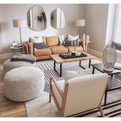 a living room filled with furniture and mirrors