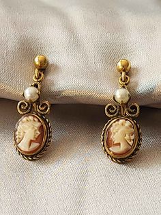 Beautiful vintage cameo earrings made by Van Dell. Marked 1/20 12k gf. Victorian Cameo Yellow Gold Earrings, Victorian Cameo Earrings For Formal Occasions, Classic Cameo Earrings, Classic Cameo Earrings Gift, Gold Cameo Earrings For Wedding, Gold Cameo Round Earrings, Victorian Gold Cabochon Earrings, Gold Victorian Cabochon Earrings, Cameo Round Earrings As Gift