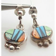 Up for sale is a Vintage ZUNI Inlay Sterling Silver Dangle Earrings. Each measures 1" by 7/16". Weight is 4.2 grams. Overall great vintage condition. Sterling will polish nicely. Comes exactly as shown. Please ask any questions before buying. Vintage Multicolor Teardrop Jewelry, Vintage Cabochon Dangle Earrings, Iowa City, Silver Dangle Earrings, Spiny Oyster, Sterling Silver Dangle Earrings, Etsy Earrings Dangle, Silver Earrings Dangle, Sterling Silber