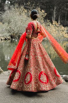 Nyquil - Blood Red Silk Modern Indian Bridal Lehenga with Dabka & Sequins Steal the spotlight this bridal season in this stunning red bridal lengha set with intricate Dabka embroidery! Sweetheart dupion silk fabric choli blouse w/ Dabka Sophisticated sweetheart neck Breathable dupion silk blouse Beaded Dori closure at back bodice Elbow-length sleeve with handwork Opulent Dabka embroidery all over Bidded hemline for a neat finishing Weightless dupion silk lengha w/ Dabka & Sequins Flared red brid Red Dola Silk Gown For Festivals, Red Semi-stitched Kundan Gown, Red Dola Silk Gown With Dupatta, Red Embroidered Dola Silk Gown, Festive Red Kundan Gown, Red Gown With Dupatta In Dola Silk, Red Embroidered Gown For Diwali, Red Gown With Pallu For Traditional Ceremonies, Festive Red Dola Silk Gown