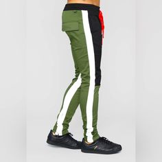 Fashion Nova Elastic Waist Extended Drawstring Side Hand Pockets Ankle Zipper Detail Material: 98% Cotton, 2% Spandex Color: Black, Olive Green, White And Red These Run On The Smaller Side. Material Is More Of A Denim/Jean Than A Sweatpants Feel. Stretch Bottoms With Side Stripes For Streetwear, Green Athleisure Bottoms With Side Stripes, Streetwear Stretch Pants With Side Stripes, Green Pants With Side Stripes For Streetwear, Green Streetwear Pants With Side Stripes, Green Side Stripe Pants For Streetwear, Stretch Joggers With Drawstring For Streetwear, Stretch Pants With Side Stripes For Streetwear, Athleisure Elastane Pants For Streetwear